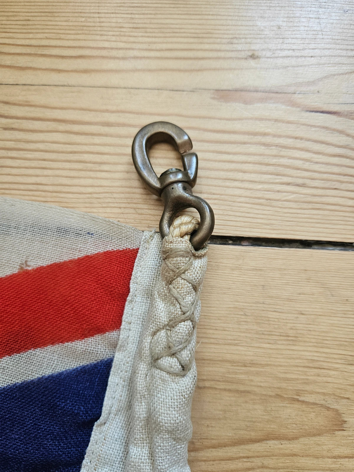 Stitched lacing loop and brass hook on hoist