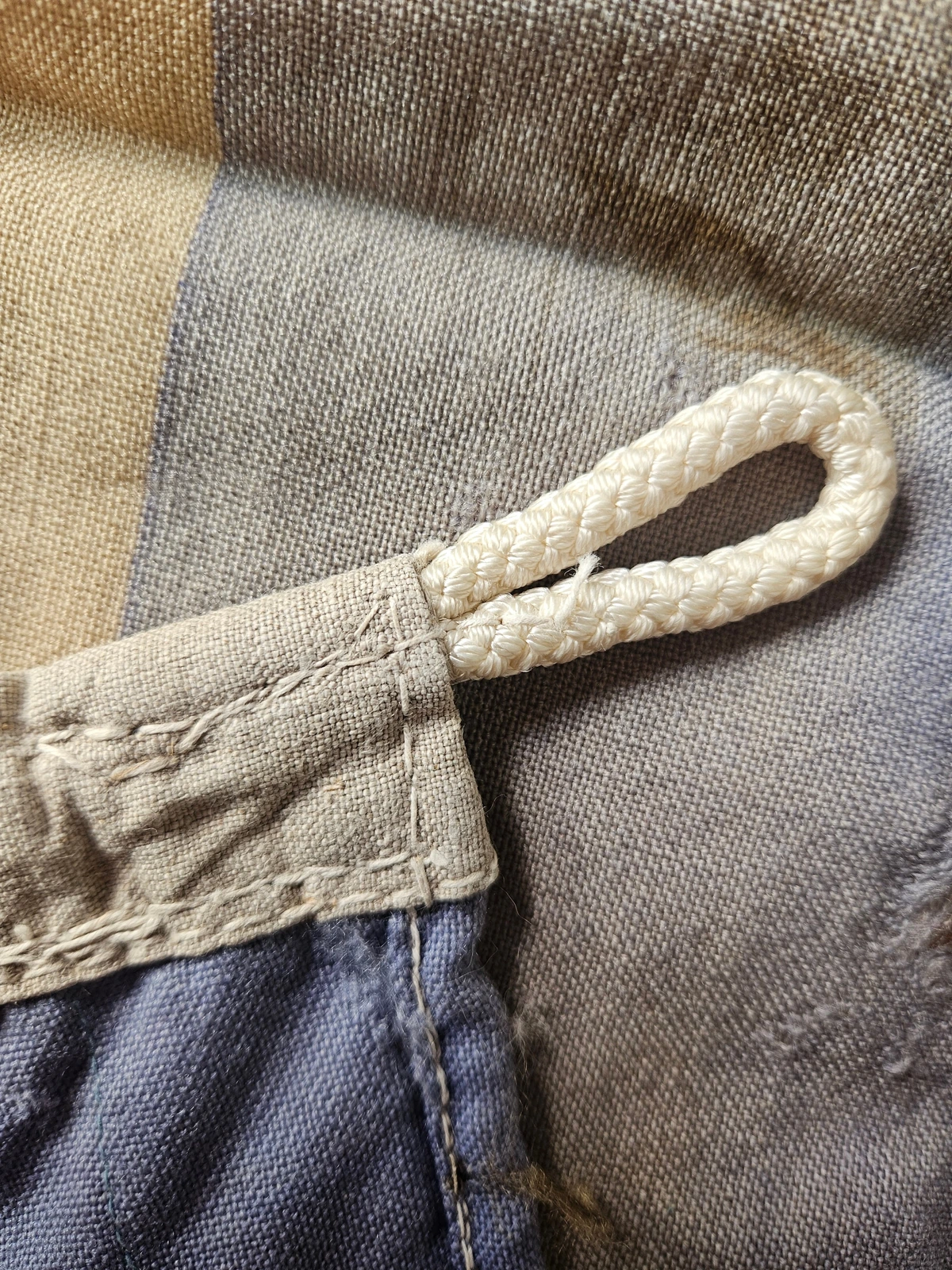 Braided hoist loop and rope core in sleeve