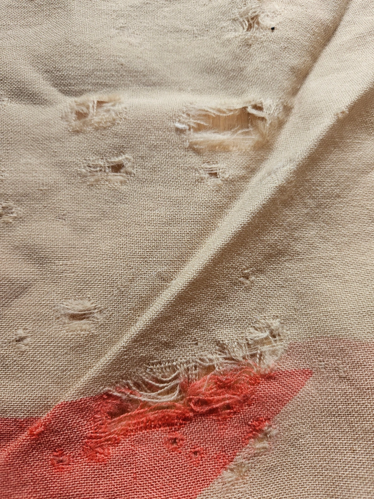 Localized wear and darns near the red star