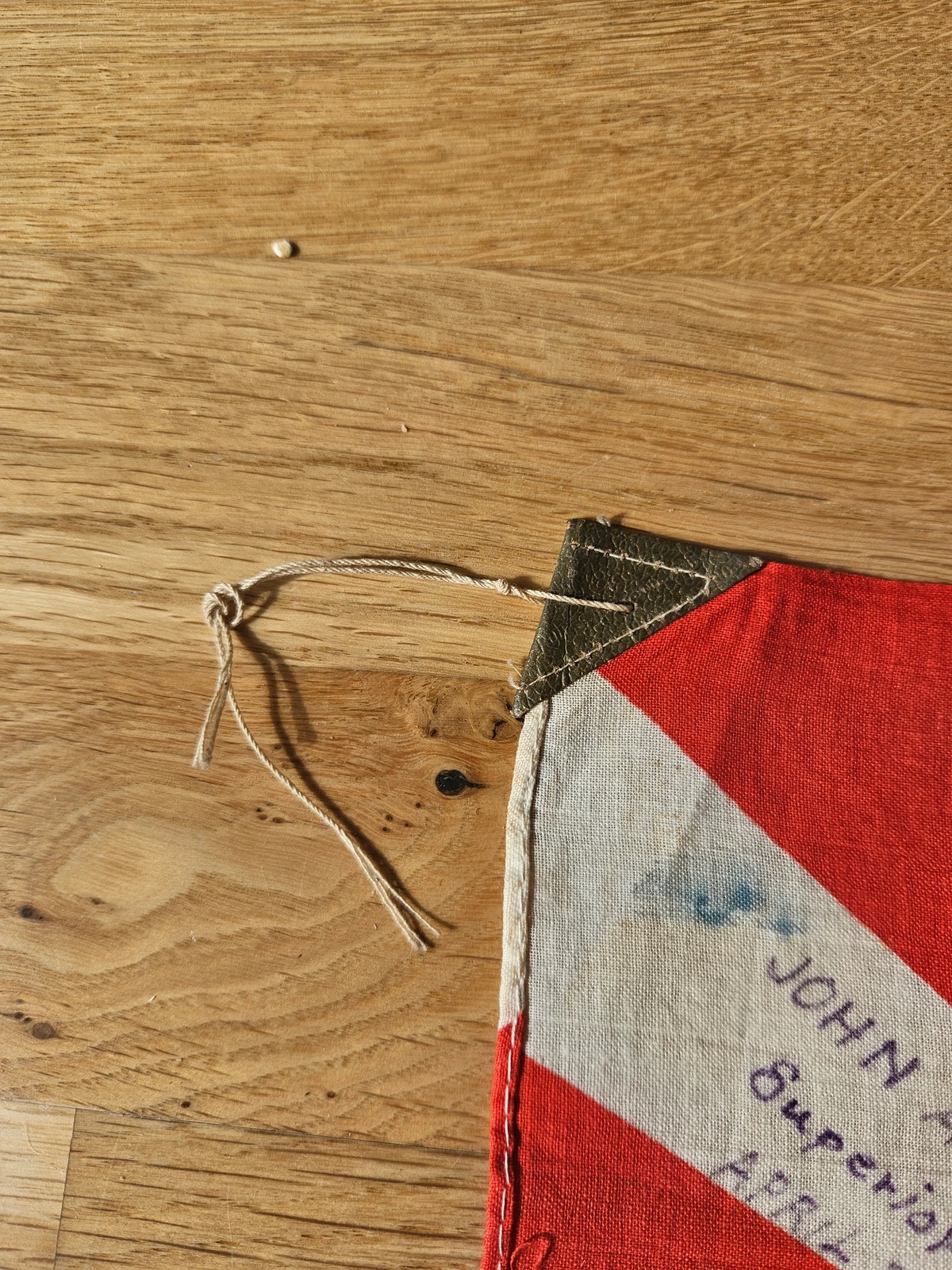 Hoist corner, stitching and cotton lanyard (detail).