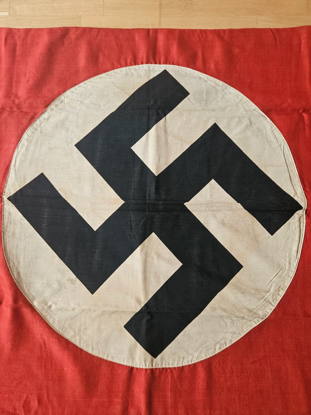 Roundel & device — cotton appliqué; centred layout; stitching pattern visible.