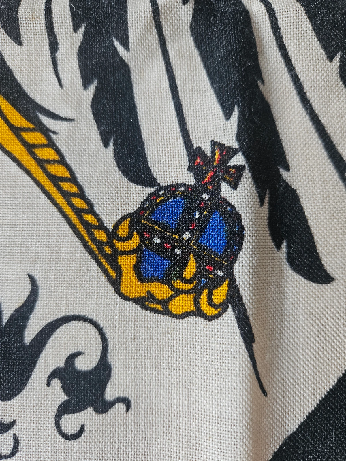 Orb — blue field, jewelling dots, yellow cradle
