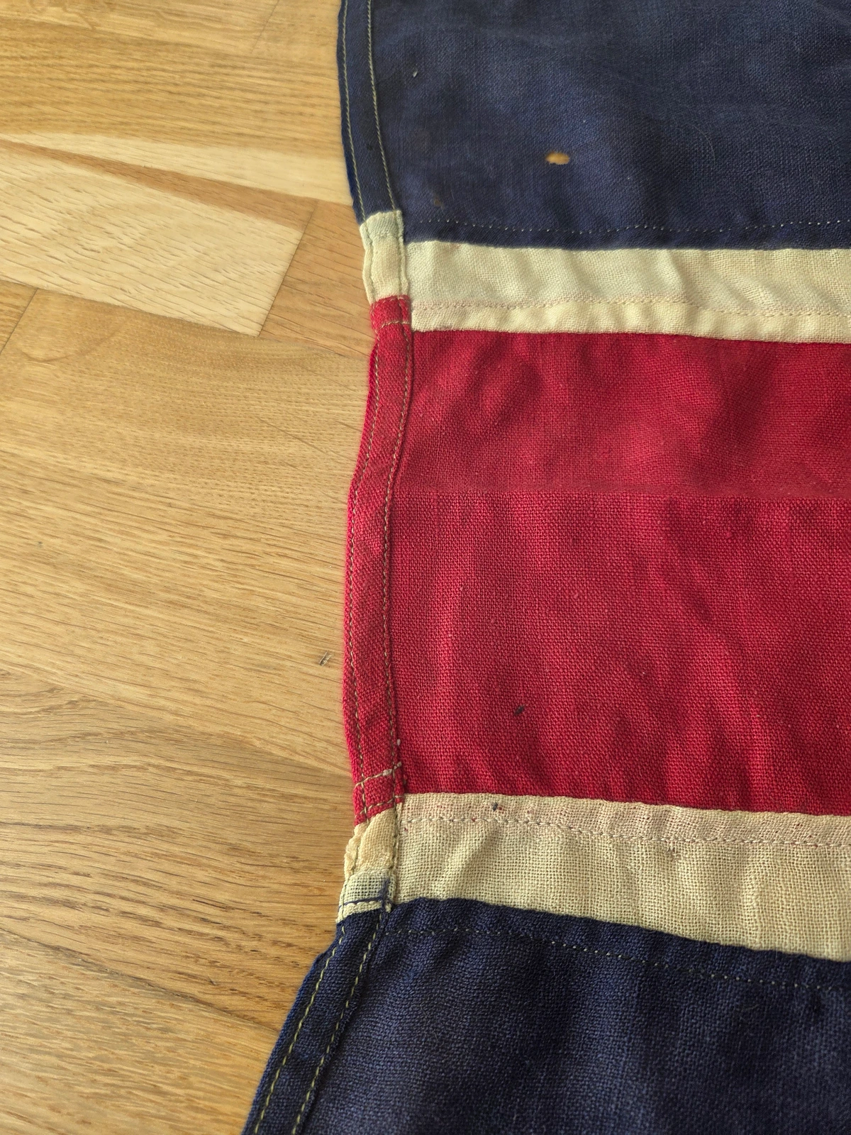 Panel join along red cross showing alignment and stitch density
