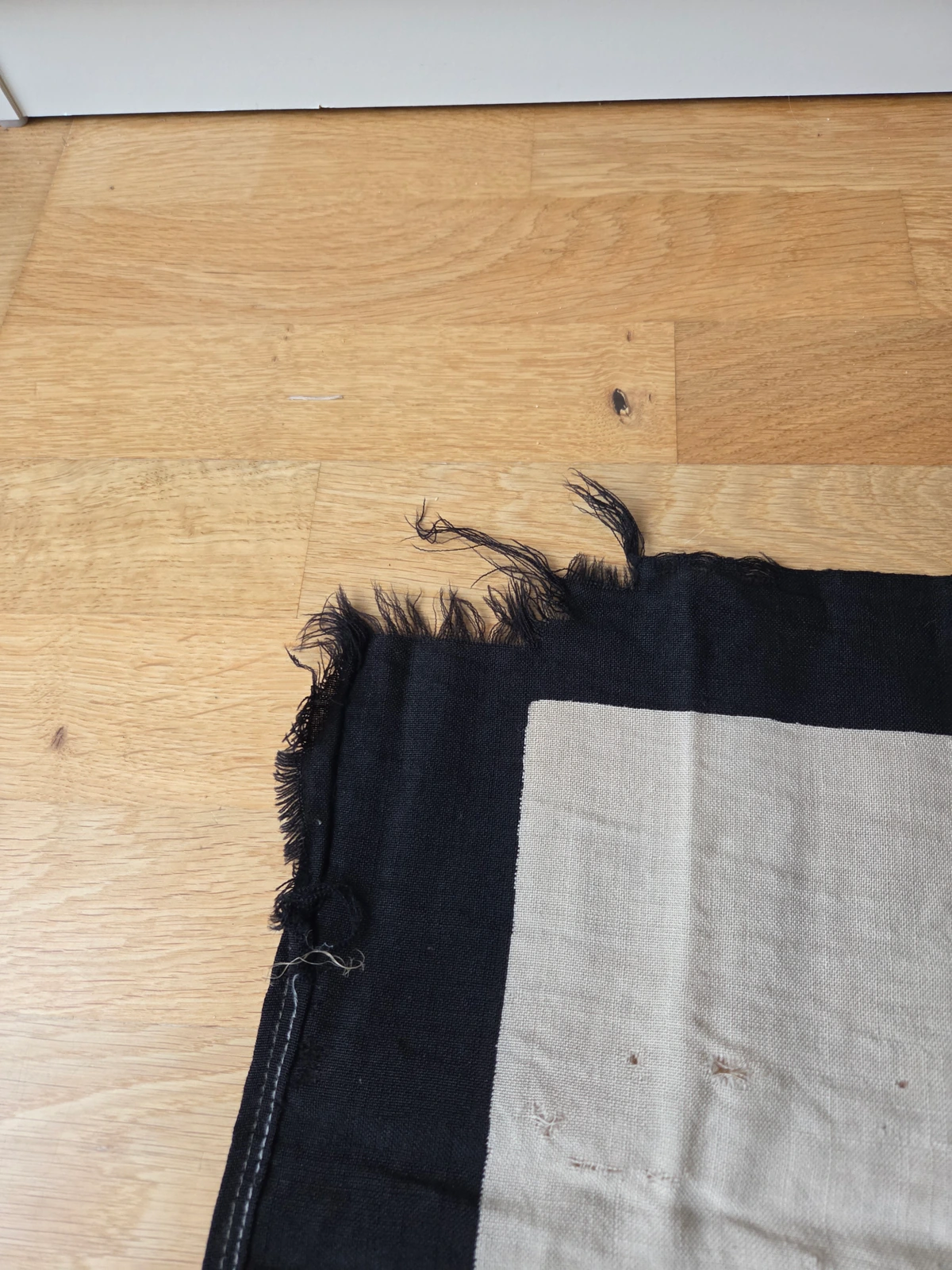 Fly edge showing operational fray and wear