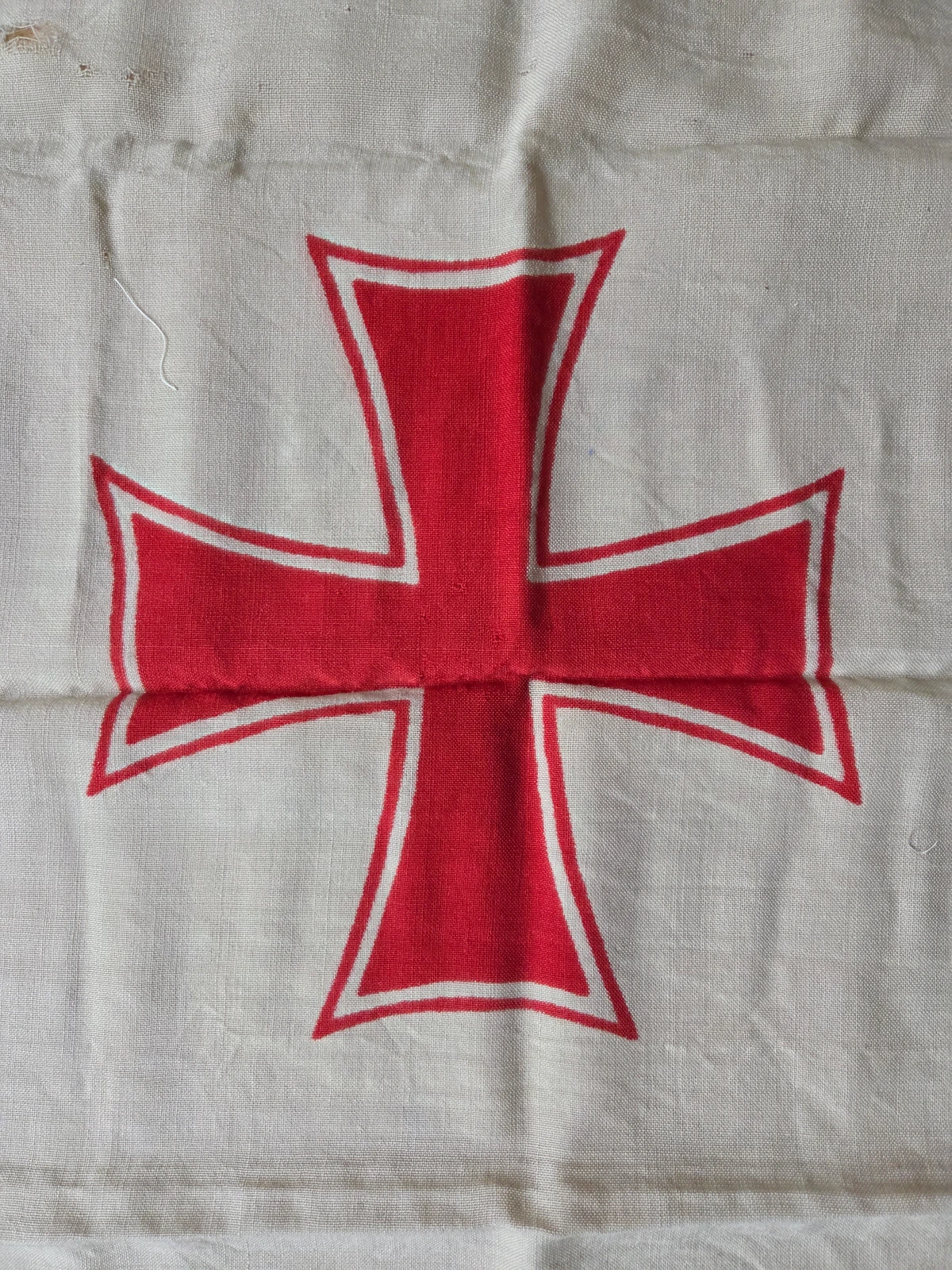 Central red cross emblem on wool bunting