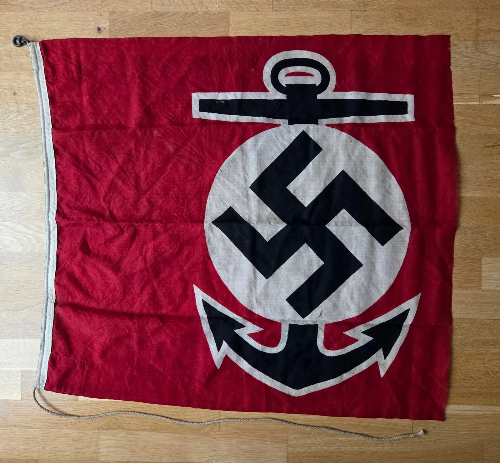 Full view of the clipped Kriegsmarine water sport flag, showing anchor and swastika emblem.