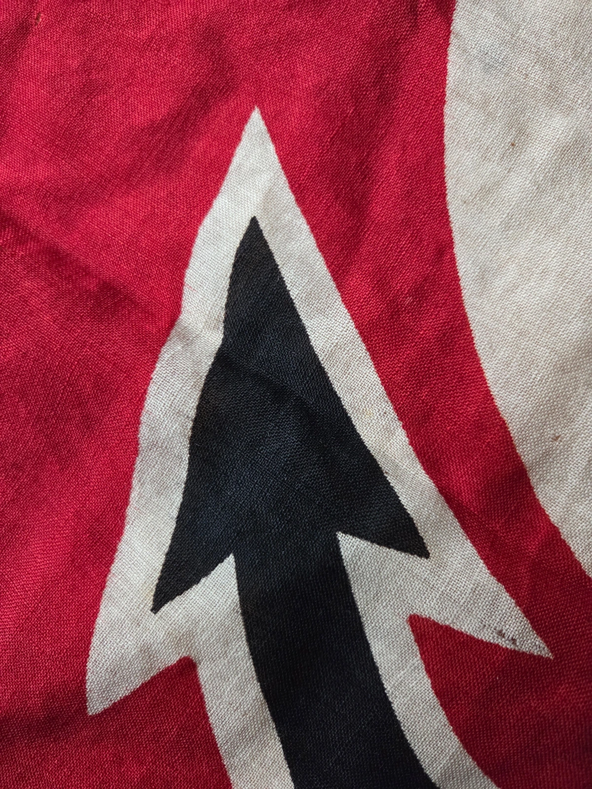 Detail of the lower anchor tip — black paint with white border alignment.