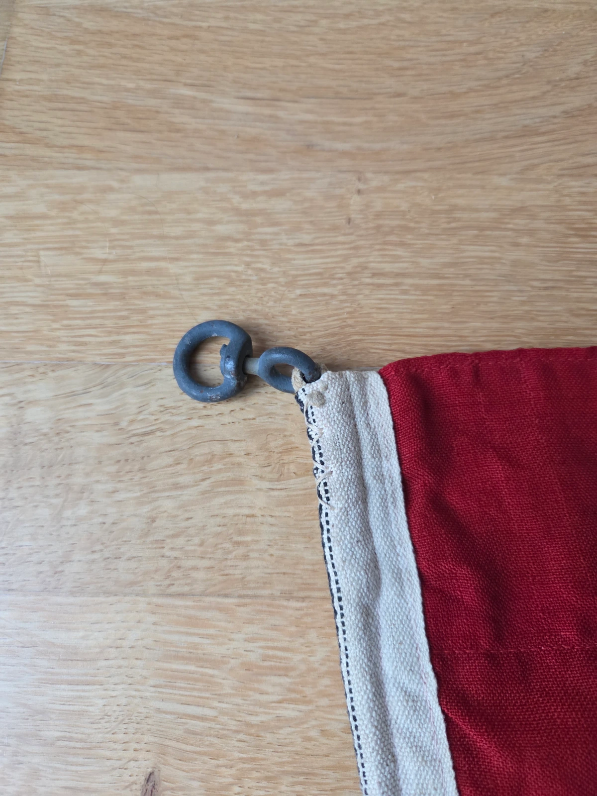 Upper hoist corner with blackened metal ring attachment.
