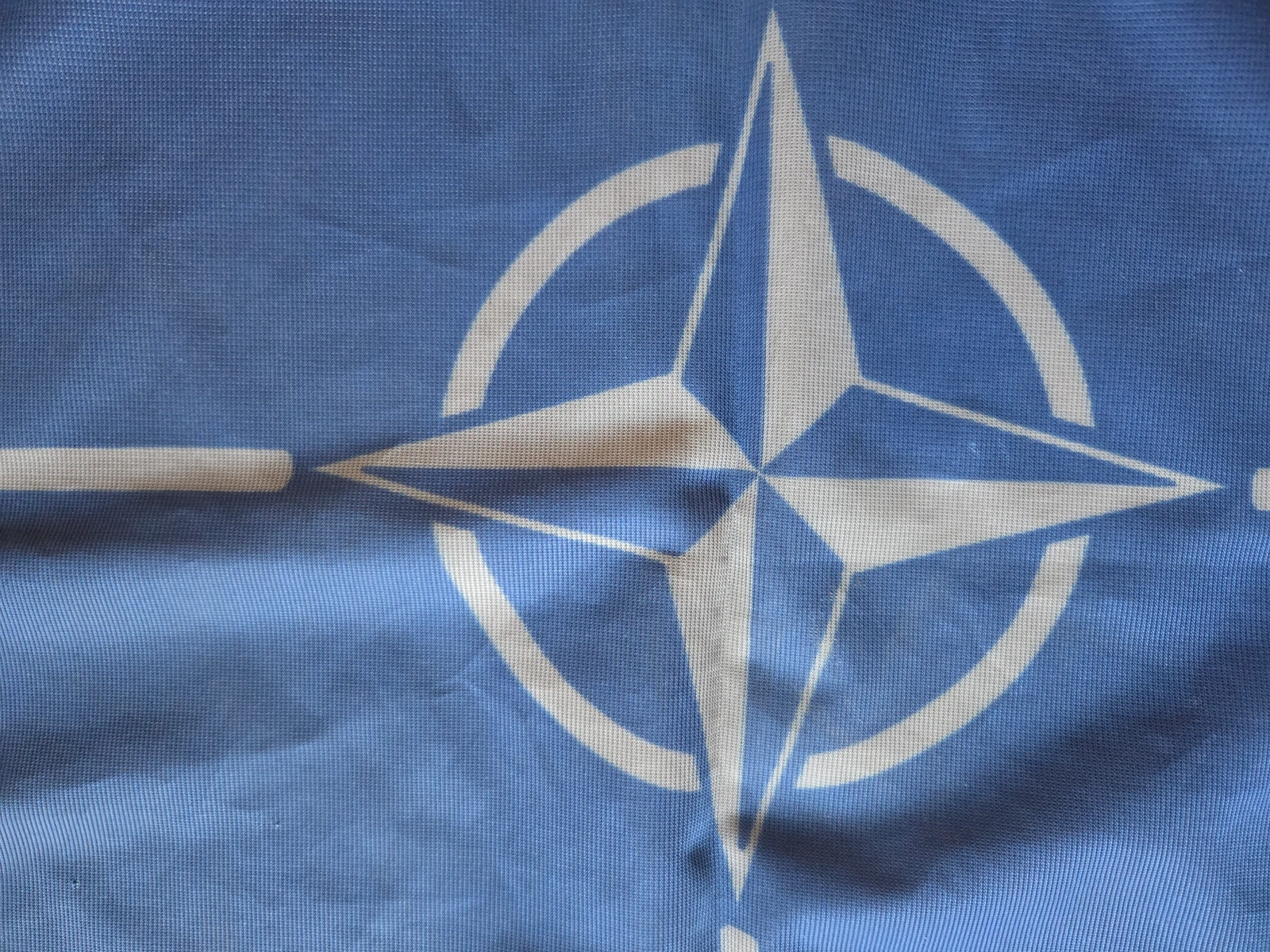 Central NATO compass rose emblem on FG-056