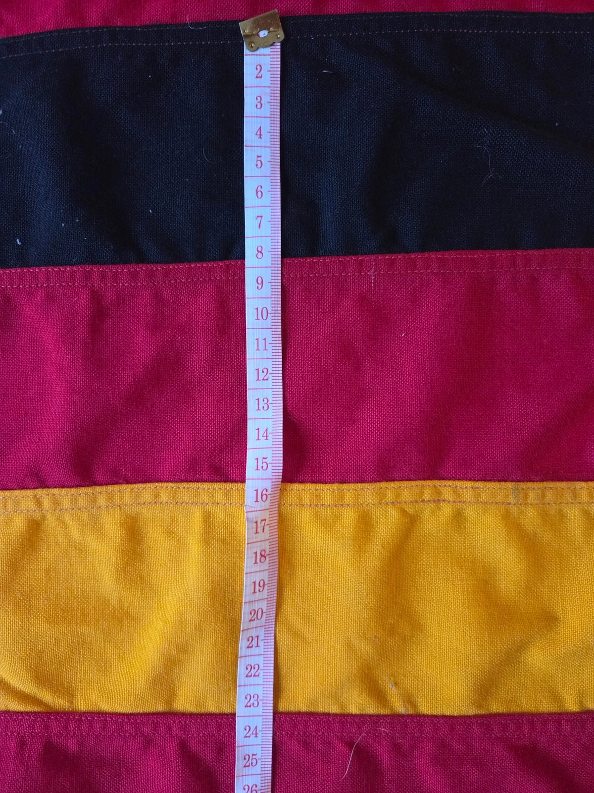 Measurement of the central black-red-gold stripe on FG-057
