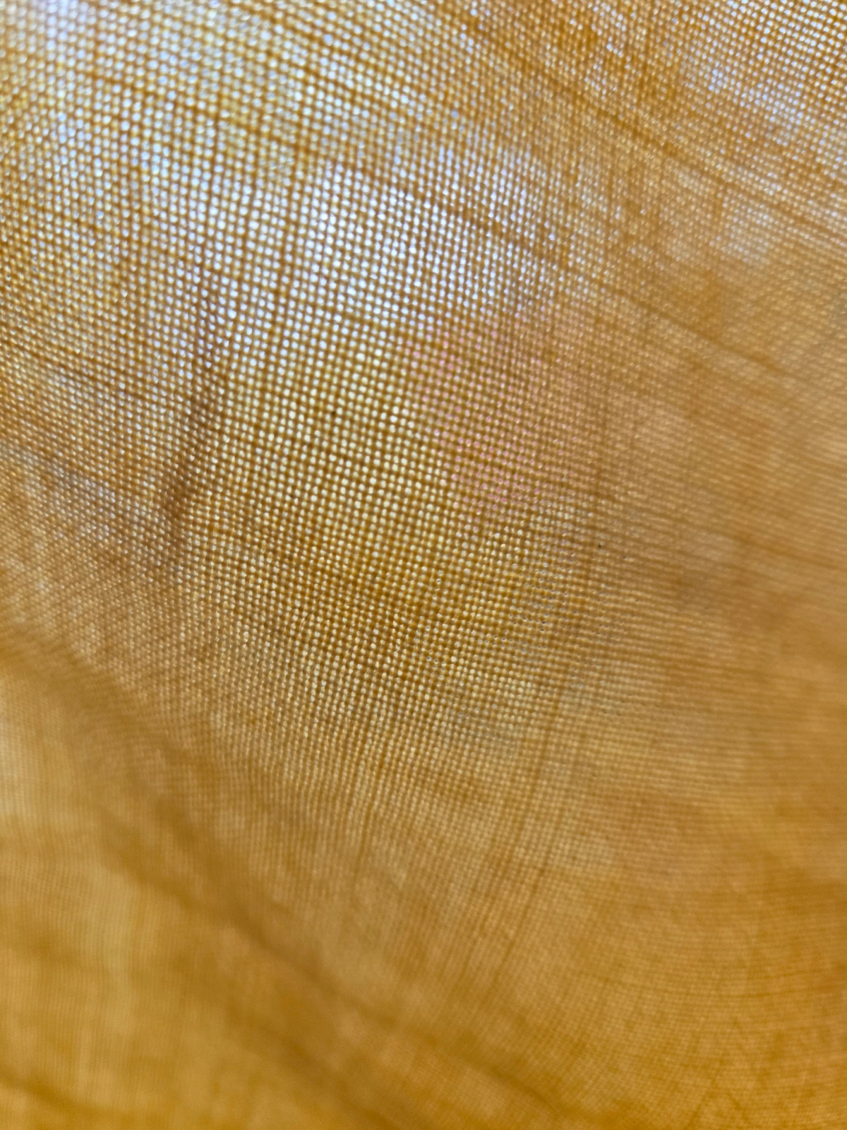 Transmitted-light view of yellow fabric