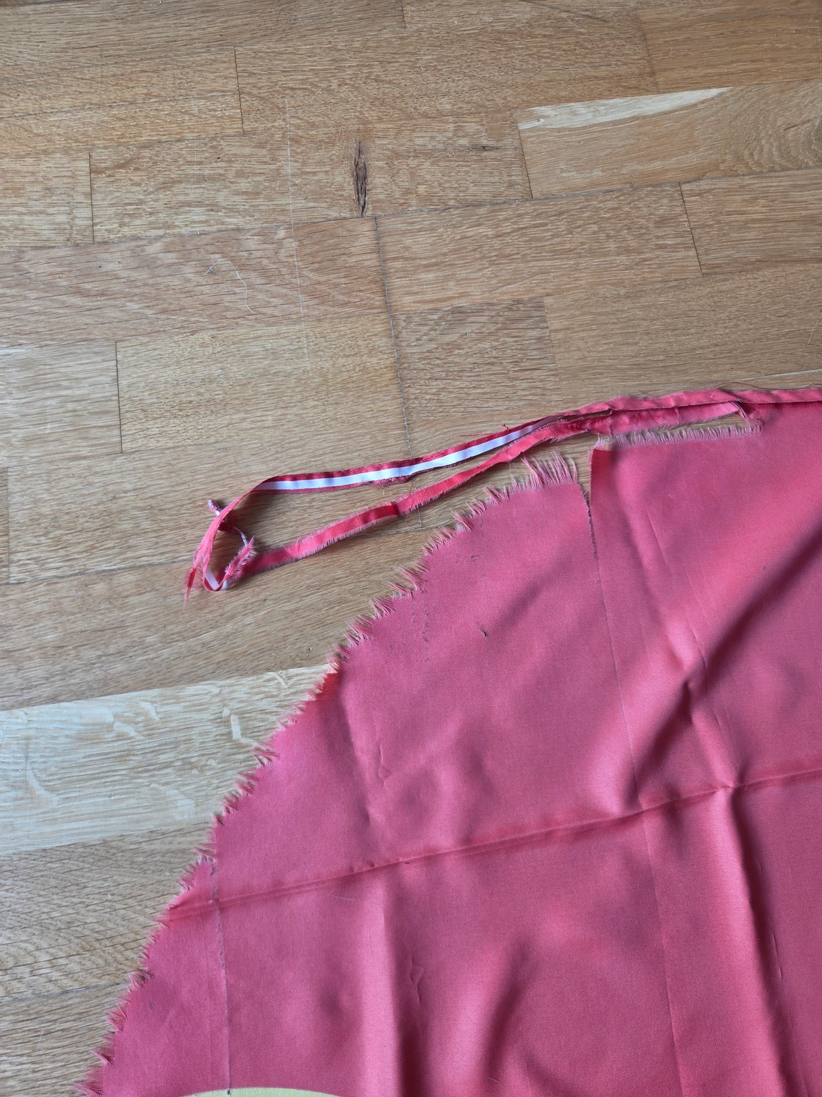 Extensive fraying and fabric loss at the upper fly end of FG-062