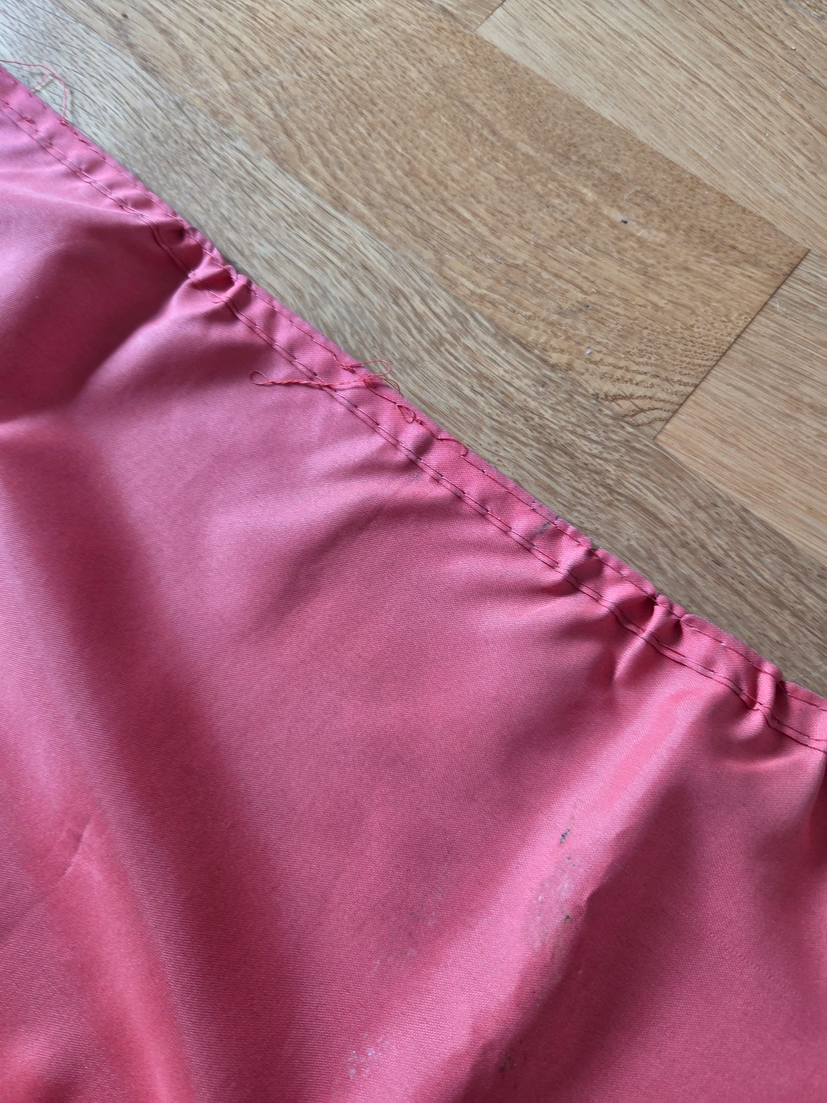 Detached upper fly hem and extensive wind damage on FG-062