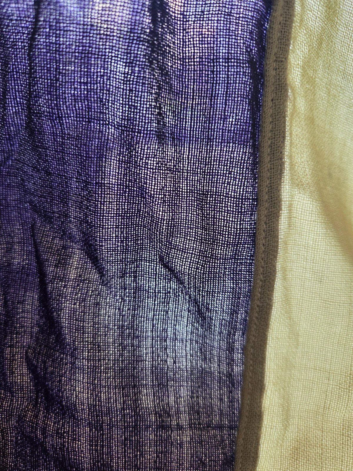 Coarse wool bunting of FG-064 held against the light