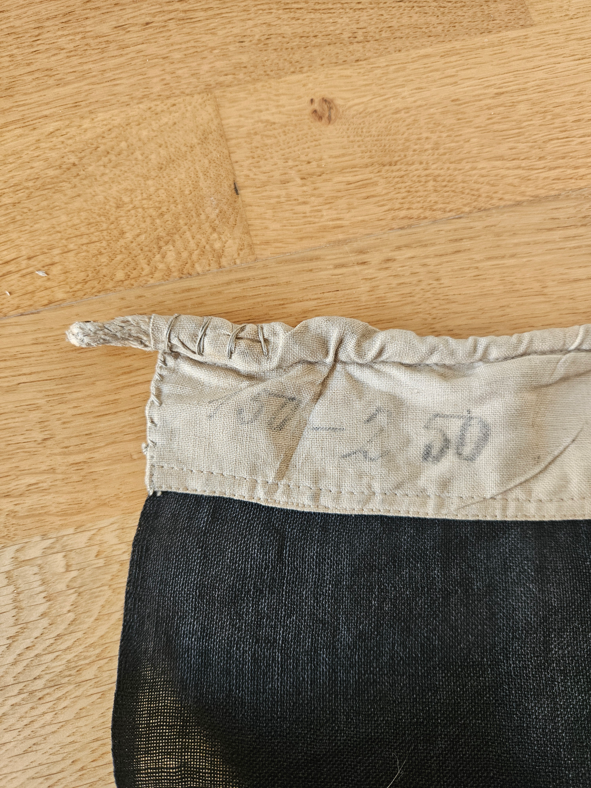 Handwritten pencil size notation in hoist