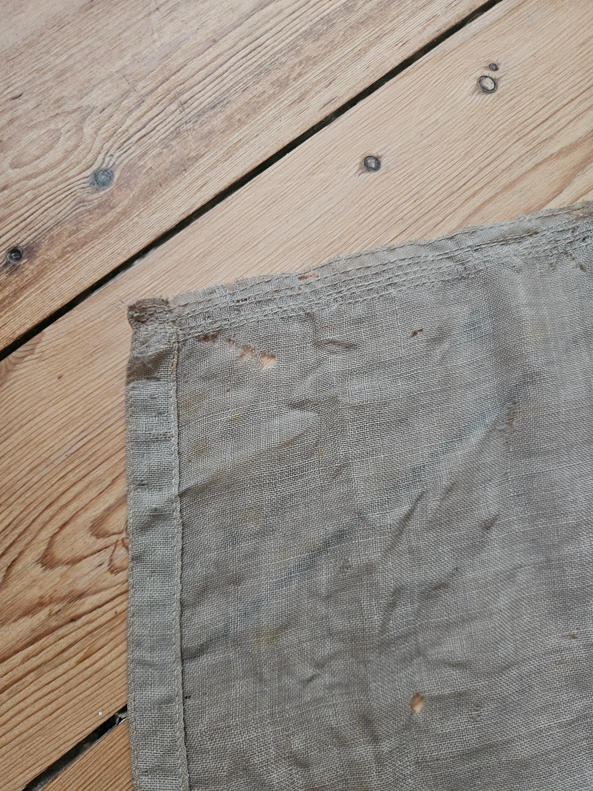 Frayed fabric and lower corner