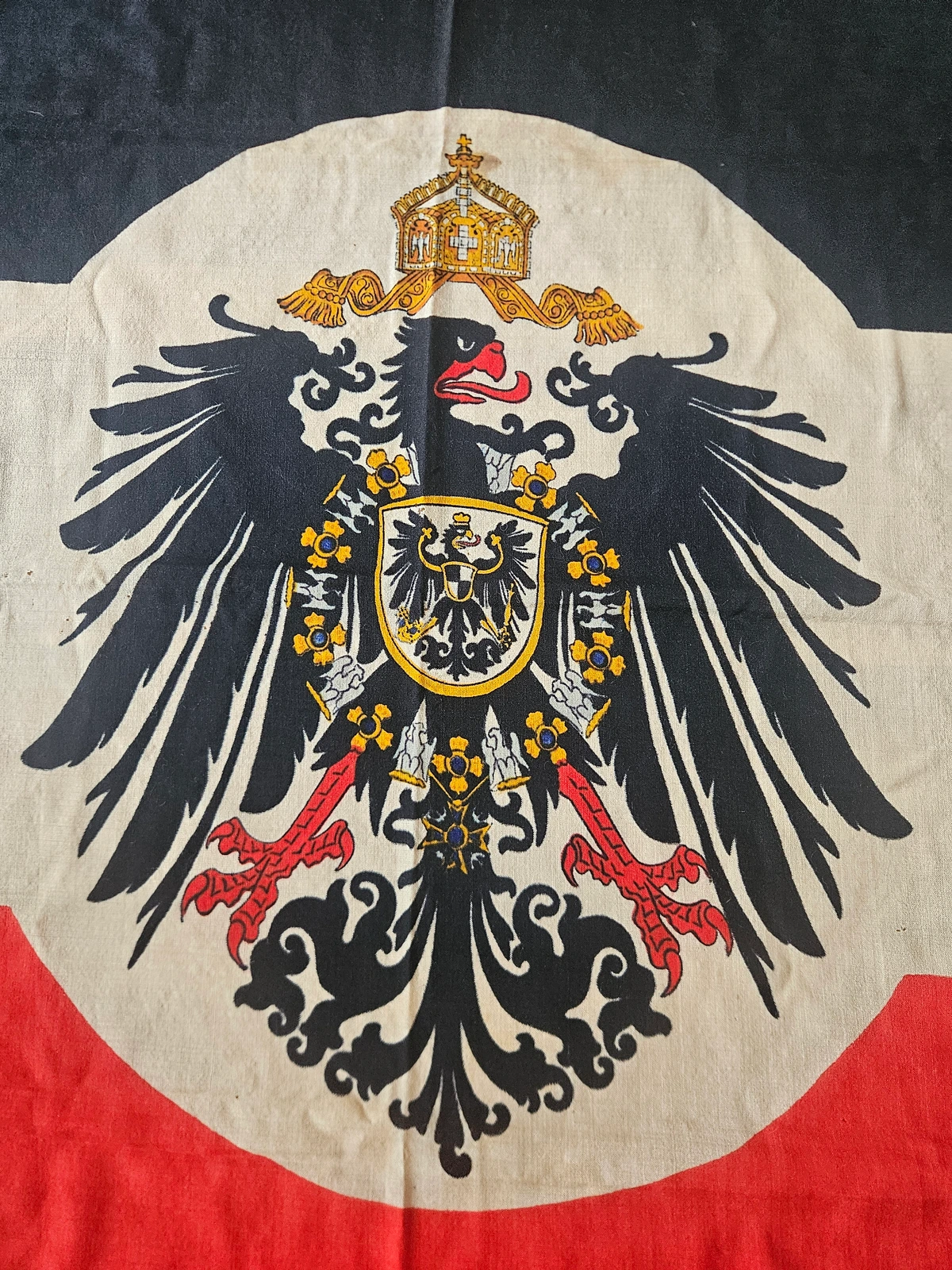 The crowned imperial eagle motif at center, showing detailed coloration and intact stitching.