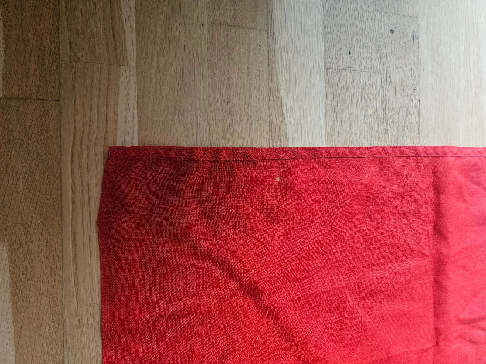 Lower fly end with original seam and clean red wool section, no modern reinforcement visible.