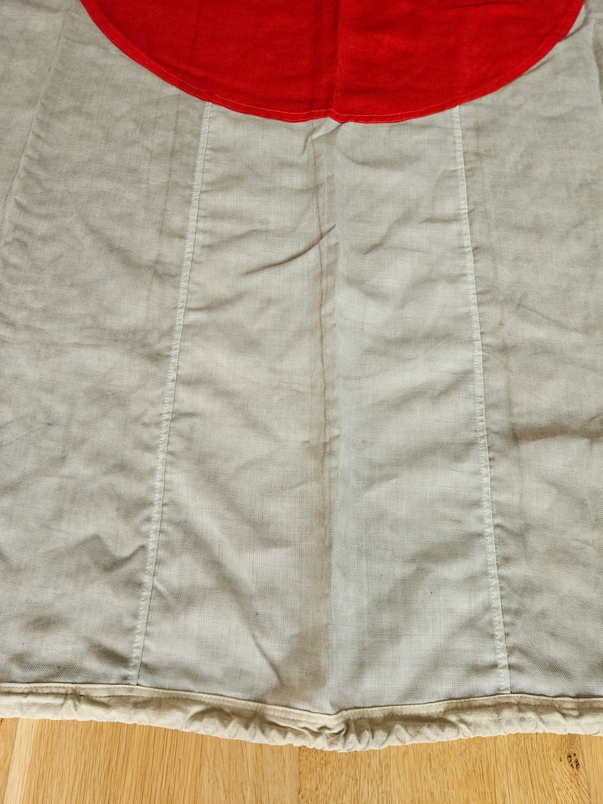 Detail showing vertical panel seams and disc stitching