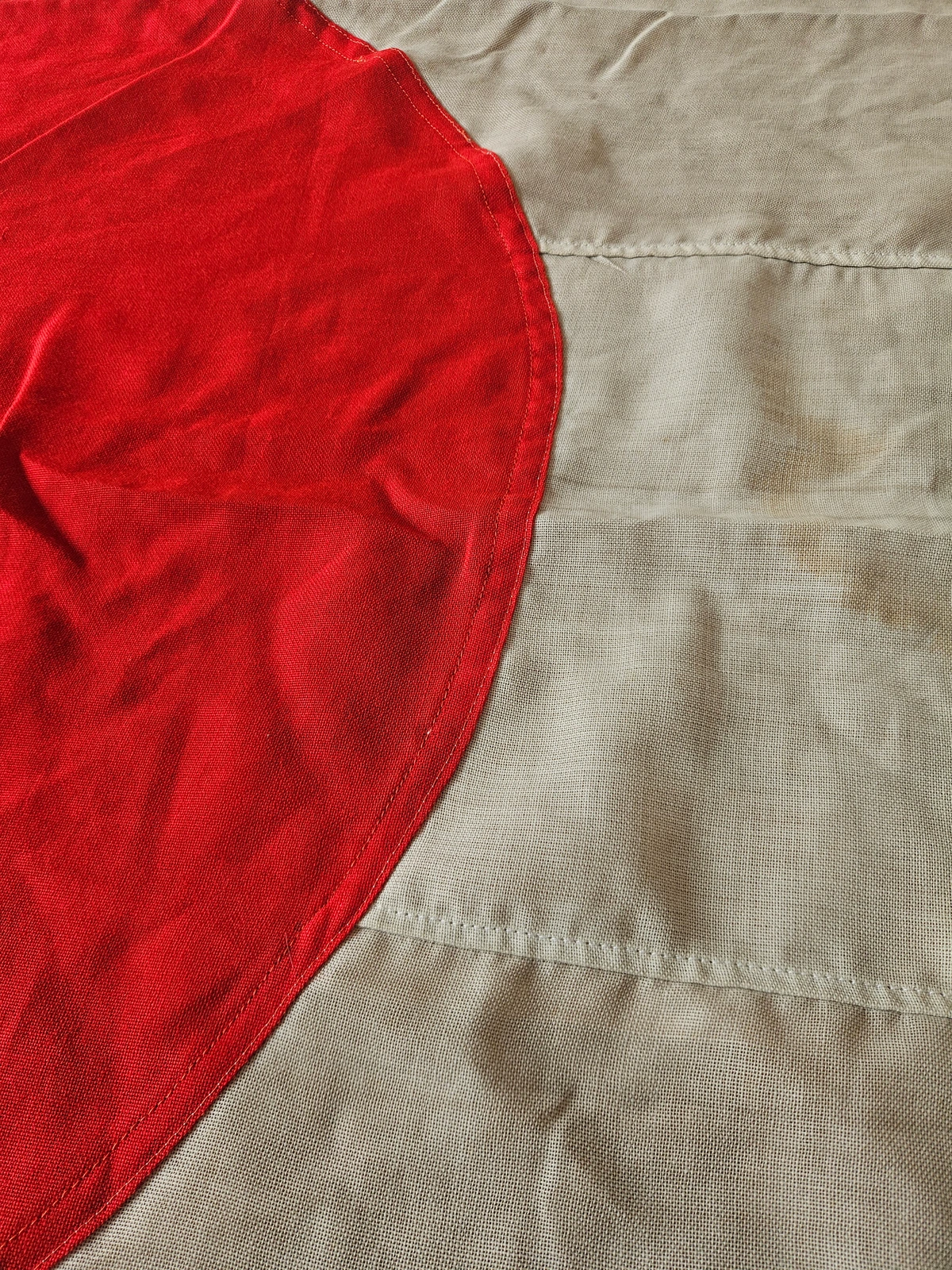 Close-up of red disc stitching