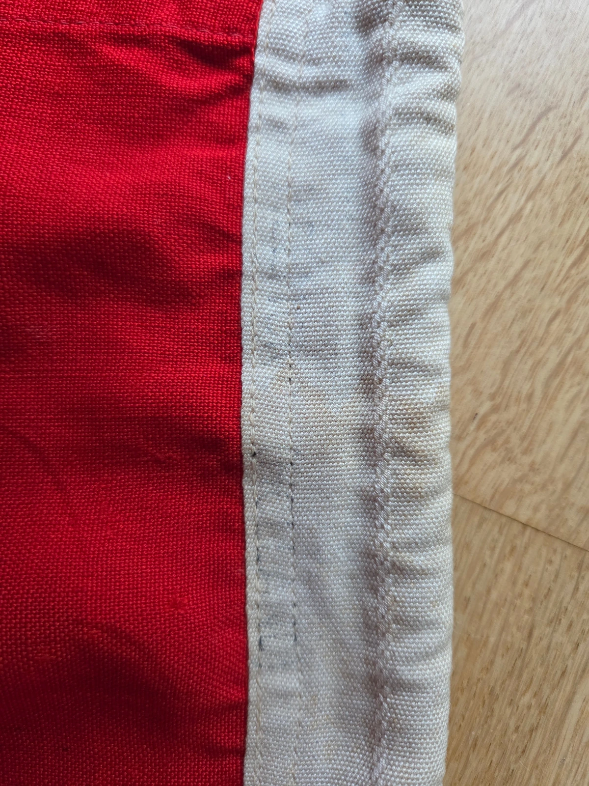 Stamp macro — weak/absorbed impression in wool bunting