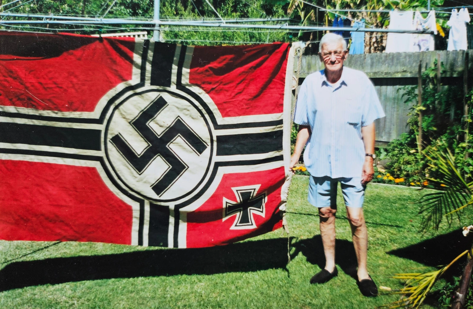 Walter Rowland with flag 2000