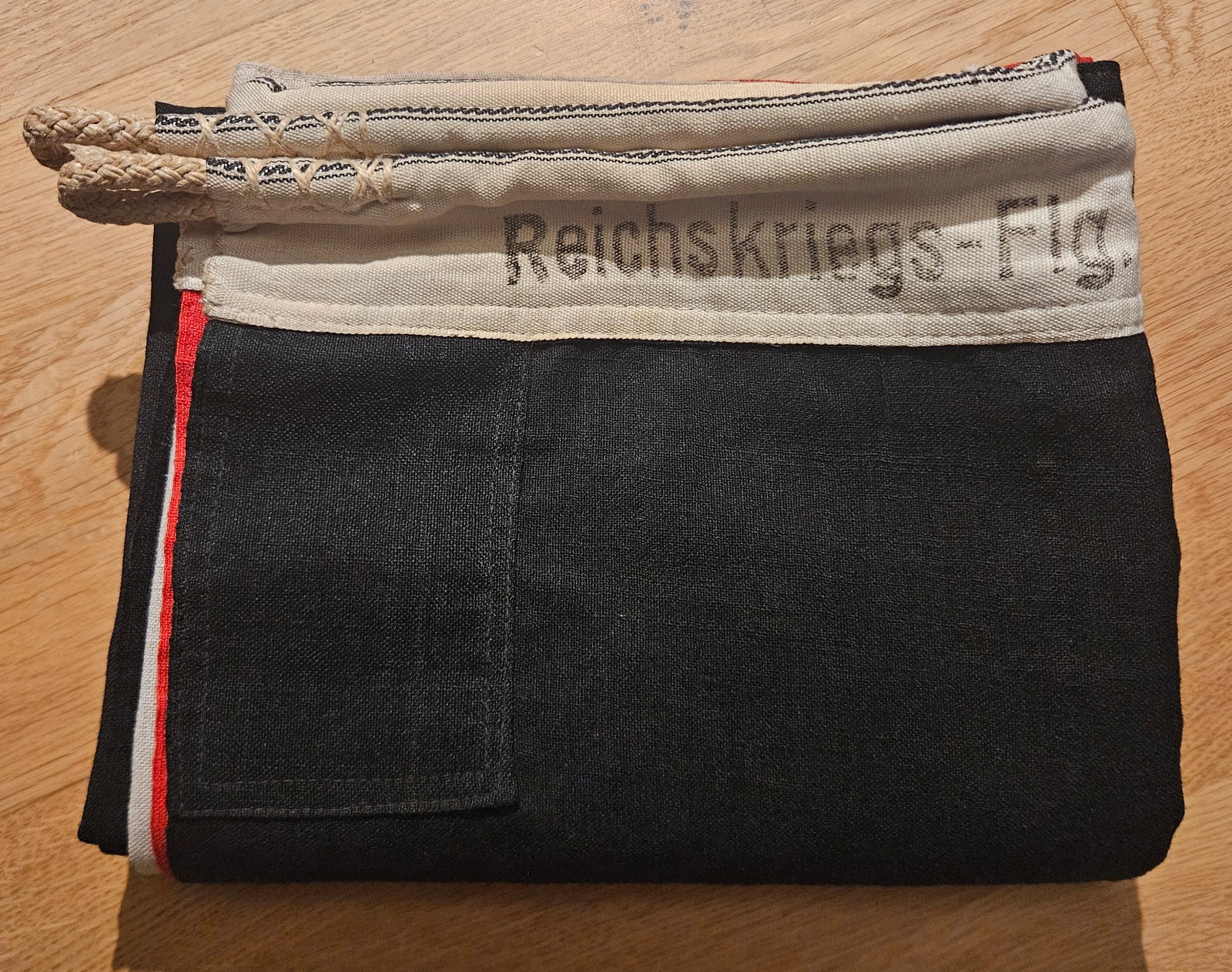 FG-007 folded flag with hoist and rope loops visible
