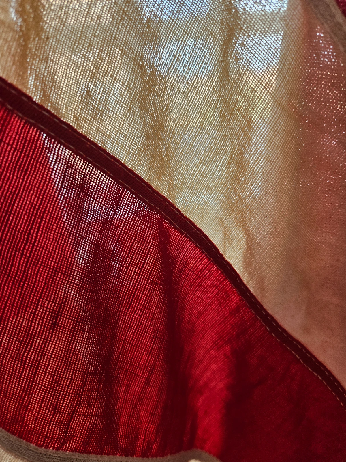 Backlit view showing open two-ply cotton bunting weave.