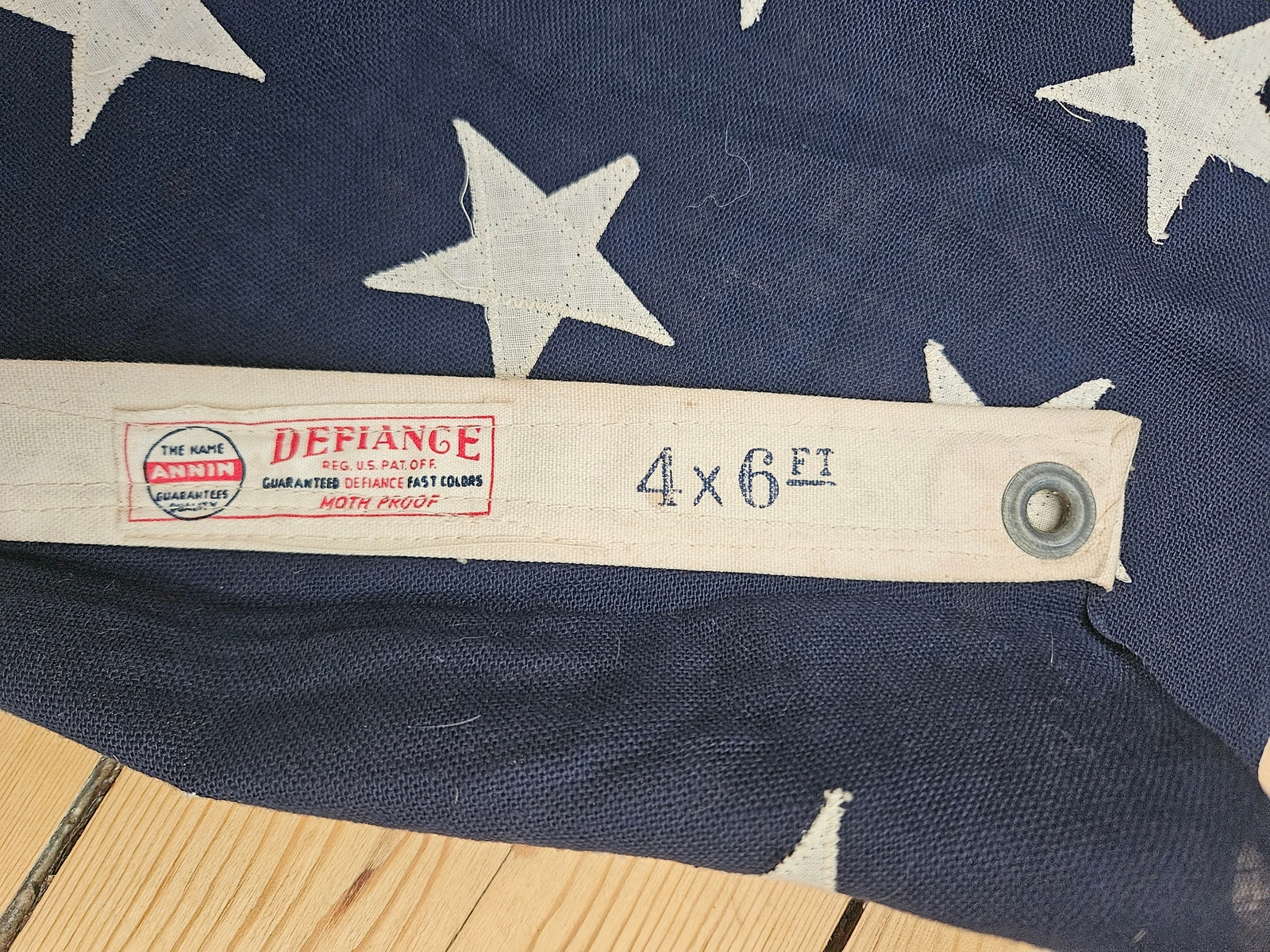 Annin Defiance brand label with 'Reg. U.S. Pat. Off.' and steel grommet (WWII period).