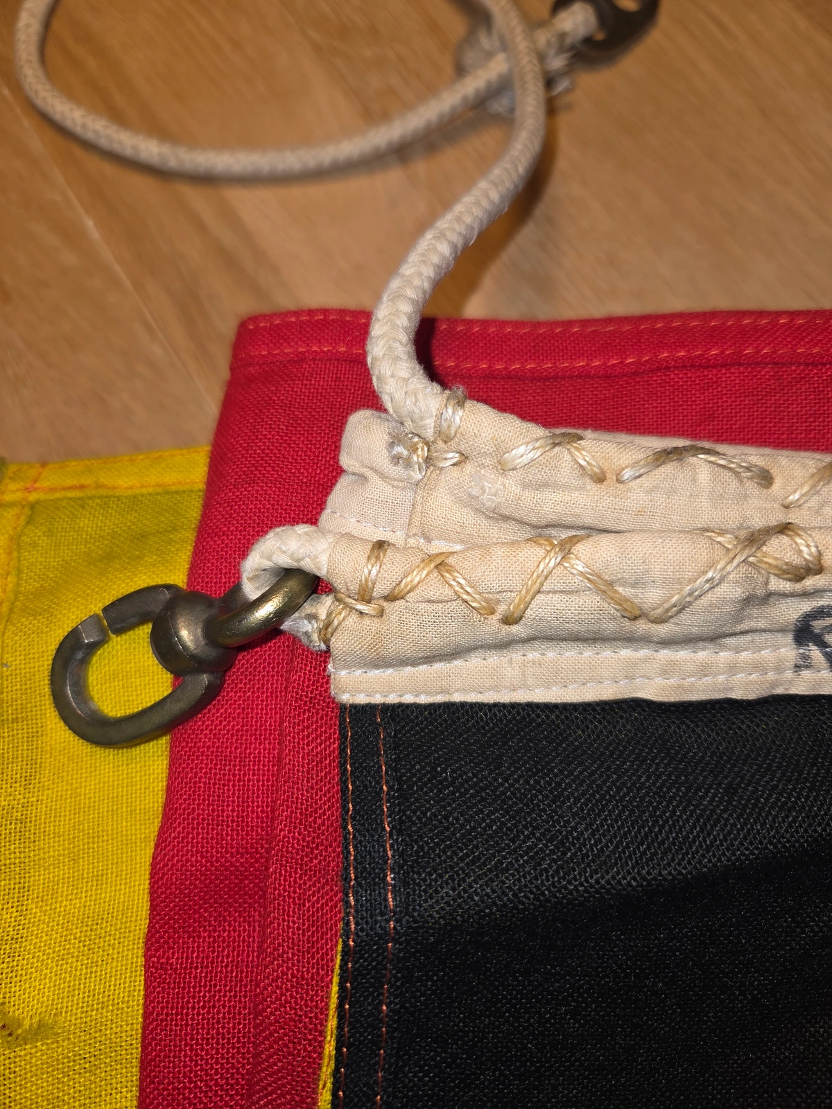 Hoist with lacing and clip